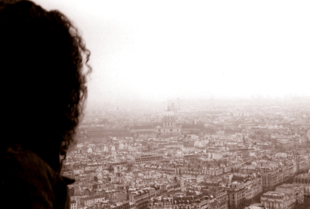 An image of a Jaiemare looking at Paris from the Eiffel Tower.