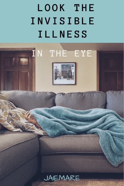 Woman sleeping on the couch with a blanket over her head suffering fro an invisible illness